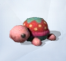 Розовая черепаха с клубникой на панцире